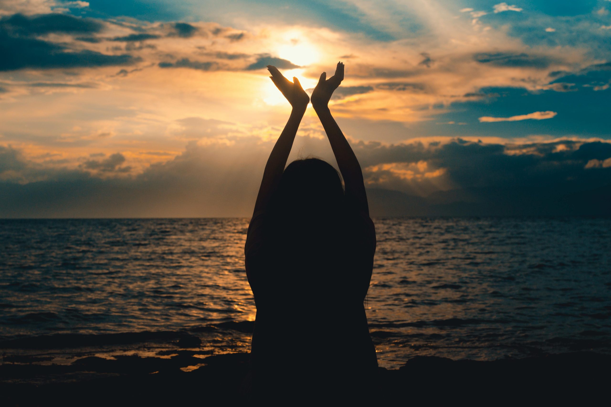 A woman facing the setting sun | Image Source: Pexels A woman facing the setting sun | Image Source: Pexels